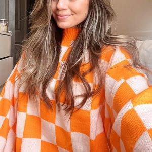 Orange checkerboard a sweater